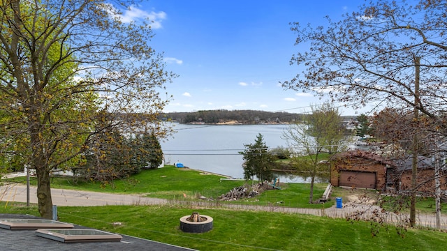 property view of water featuring an outdoor fire pit