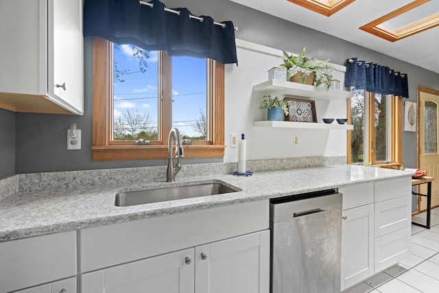 kitchen featuring stainless steel dishwasher, open shelves, a sink, white cabinets, and light tile patterned flooring