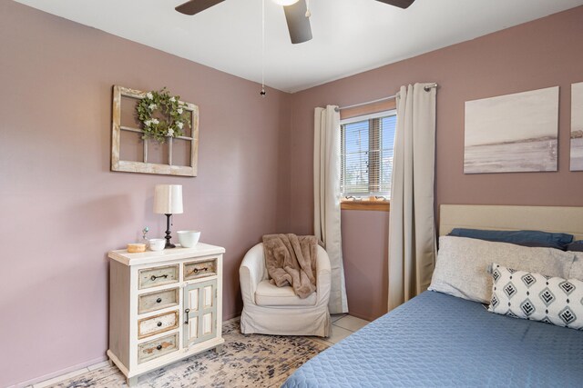 bedroom featuring baseboards and ceiling fan