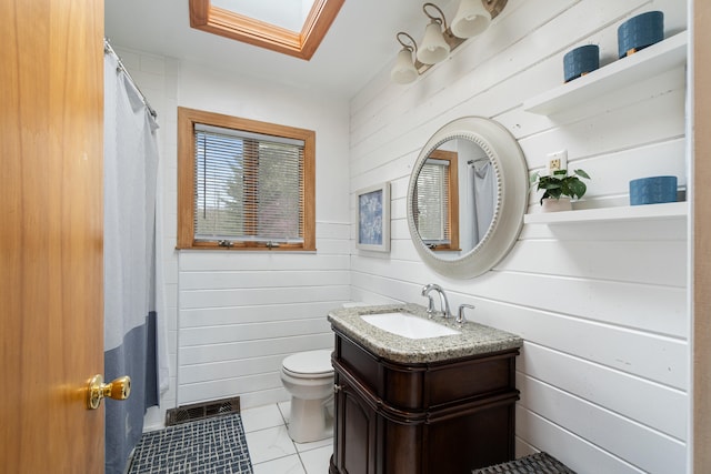 full bath with a skylight, toilet, and wood walls