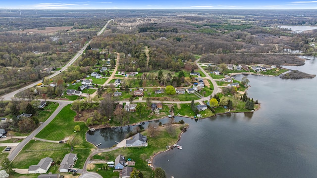 drone / aerial view with a view of trees and a water view