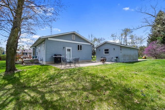 back of property featuring a lawn and a patio