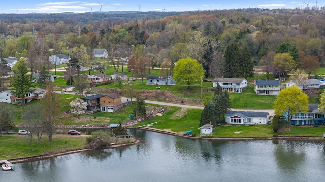 birds eye view of property featuring a residential view, a view of trees, and a water view
