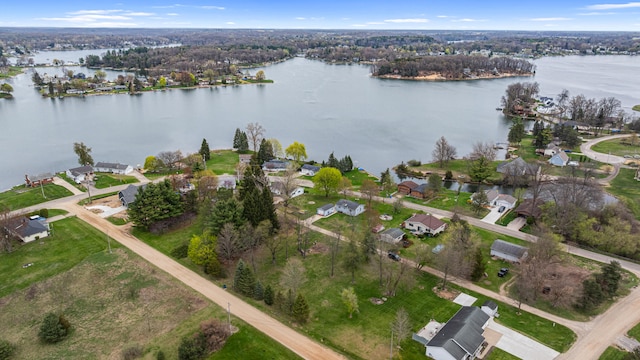 drone / aerial view with a water view and a residential view