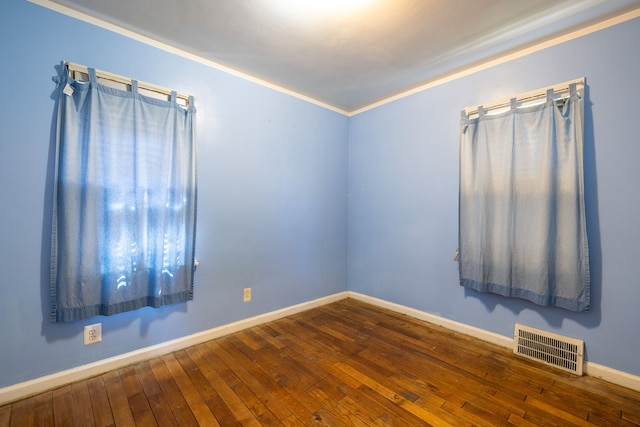 19302 Moross Rd, Detroit, MI 48224 - unfurnished room with hardwood / wood-style flooring, baseboards, and crown molding