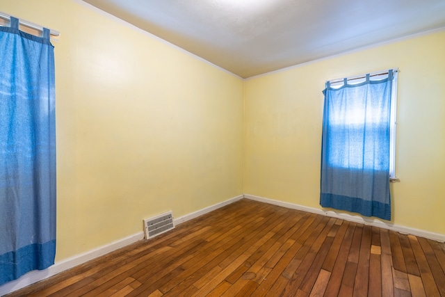 19302 Moross Rd, Detroit, MI 48224 - empty room featuring dark wood-style flooring and baseboards