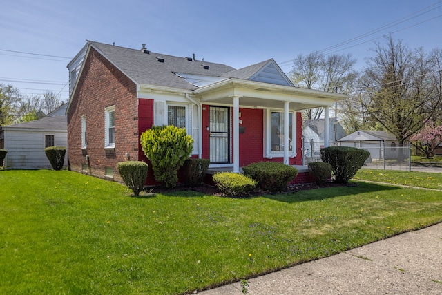 19302 Moross Rd, Detroit, MI 48224 - bungalow-style home with brick siding, a shingled roof, covered porch, and a front lawn