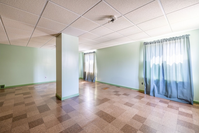 19302 Moross Rd, Detroit, MI 48224 - basement featuring baseboards, a paneled ceiling, and tile patterned floors