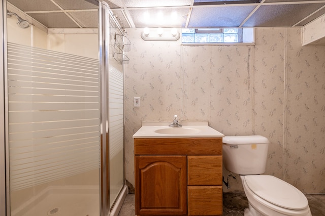 full bath featuring a stall shower, vanity, and toilet