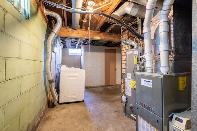 basement with washer / clothes dryer, heating unit, and gas water heater