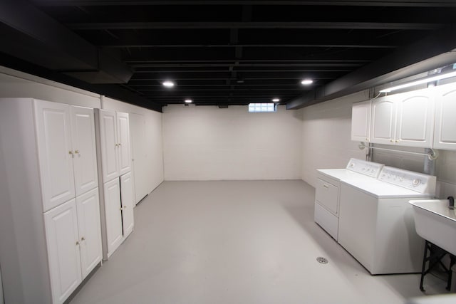laundry room with cabinet space and washing machine and clothes dryer