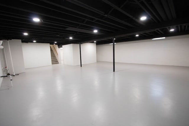 finished basement featuring stairway