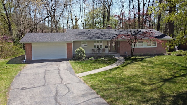 ranch-style house with a garage, aphalt driveway, a front yard, brick siding, and a porch