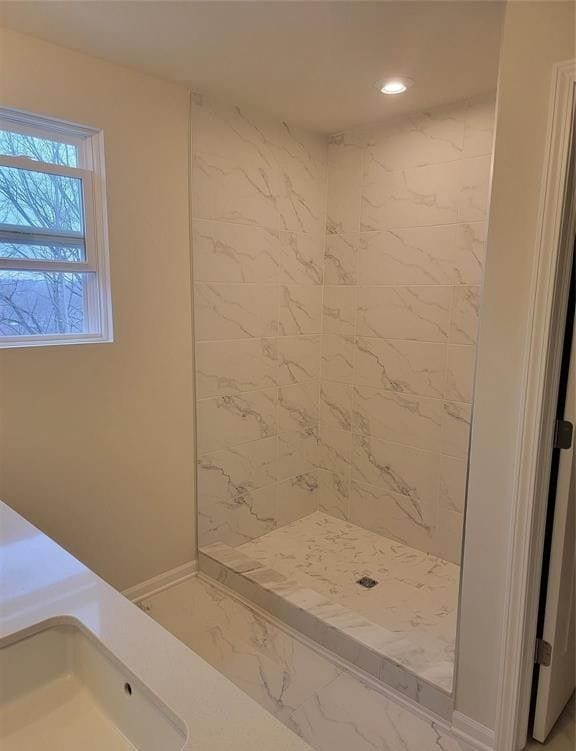 full bathroom with recessed lighting, baseboards, marble finish floor, and a stall shower