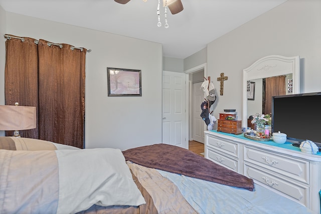 bedroom featuring a ceiling fan and light wood-style flooring