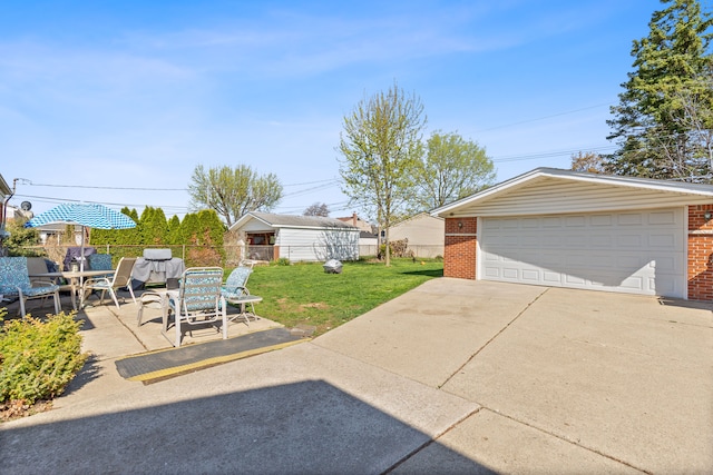 exterior space featuring an outdoor structure, a garage, and fence