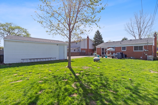 view of yard featuring a patio and central AC unit