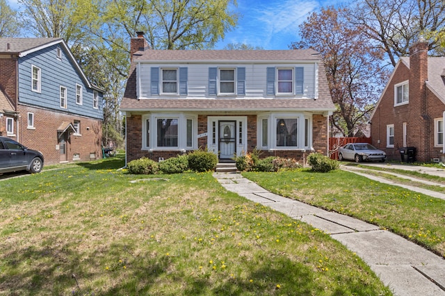 14174 Archdale St, Detroit, MI 48227 - bungalow with brick siding, a chimney, a shingled roof, and a front yard