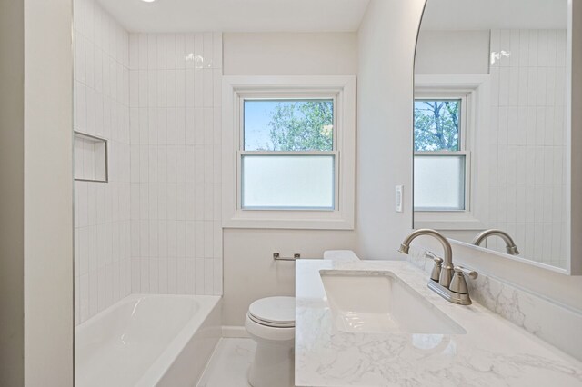 full bathroom featuring toilet, tub / shower combination, and vanity