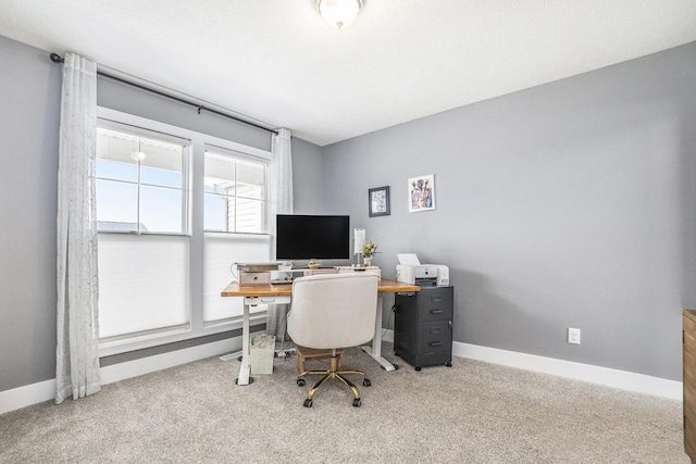 home office with baseboards and carpet