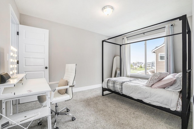 carpeted bedroom with baseboards