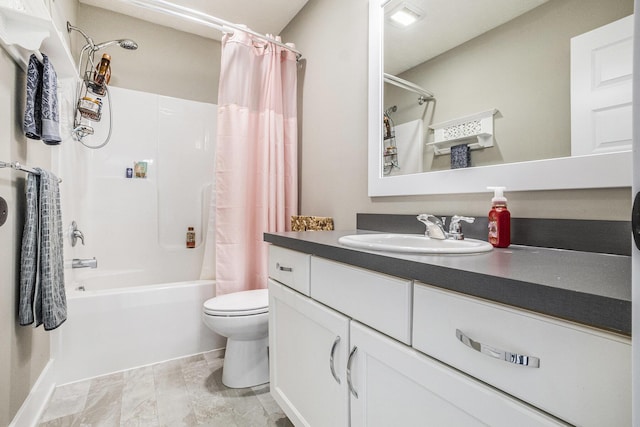 bathroom with vanity, toilet, and shower / tub combo