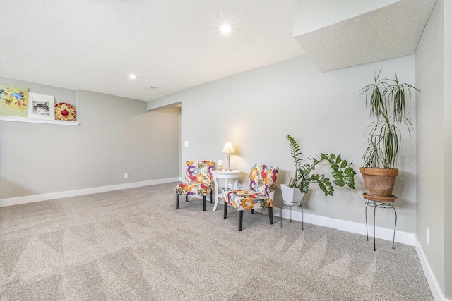 living area with baseboards, carpet flooring, and recessed lighting