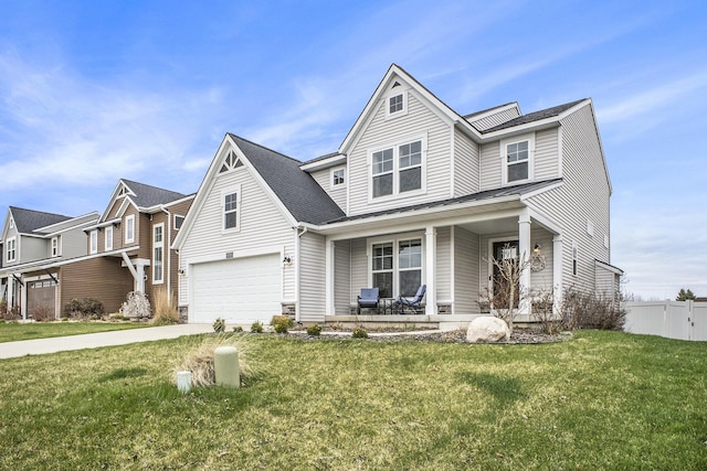 traditional home featuring a garage, fence, a front yard, concrete driveway, and a porch