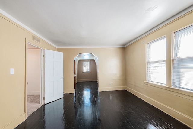 5279 E Somerset Ave, Detroit, MI 48224 - spare room with arched walkways, wood-type flooring, baseboards, and crown molding