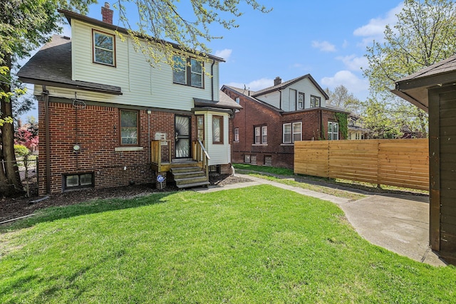 5279 E Somerset Ave, Detroit, MI 48224 - back of house with a chimney, roof with shingles, and brick siding