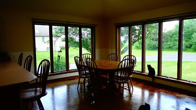 7407 Beecher Rd, Flint, MI 48532 - dining room featuring plenty of natural light, vaulted ceiling, and dark wood-type flooring