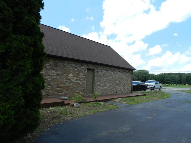 7407 Beecher Rd, Flint, MI 48532 - view of home's exterior with brick siding