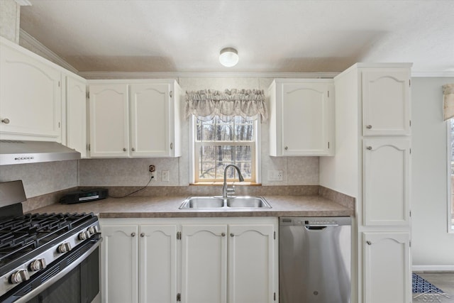 kitchen featuring under cabinet range hood, stainless steel appliances, white cabinets, and a sink