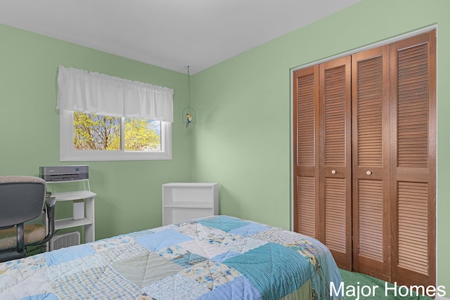 bedroom featuring a closet and carpet floors