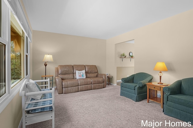 living room with carpet floors and baseboards