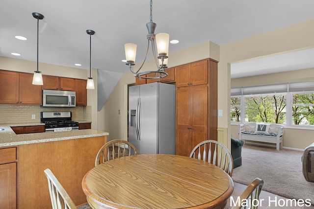 carpeted dining space with baseboards and recessed lighting
