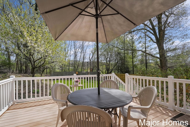 wooden deck featuring outdoor dining space