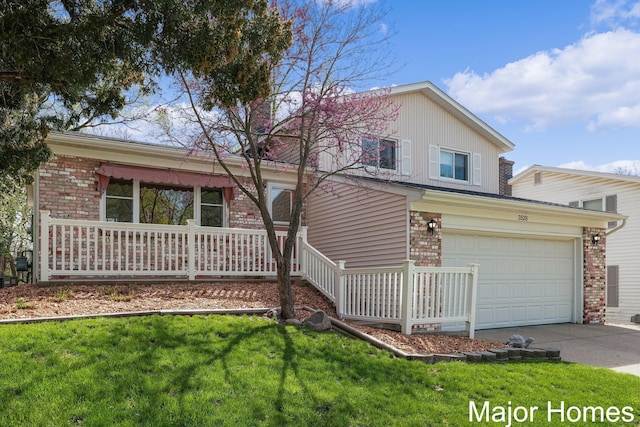 view of front of home featuring brick siding, a front lawn, and driveway
