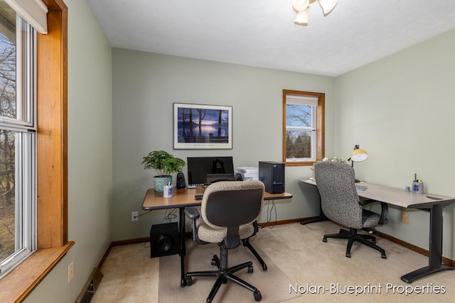 office space with carpet floors and baseboards