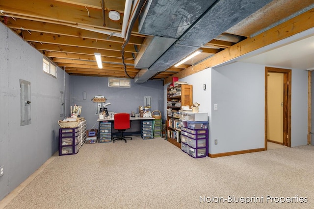 carpeted home office featuring electric panel