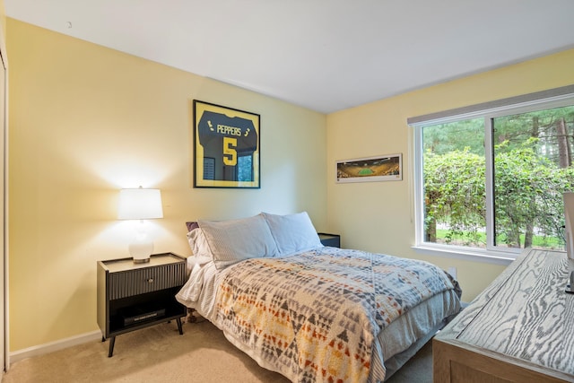 carpeted bedroom with baseboards