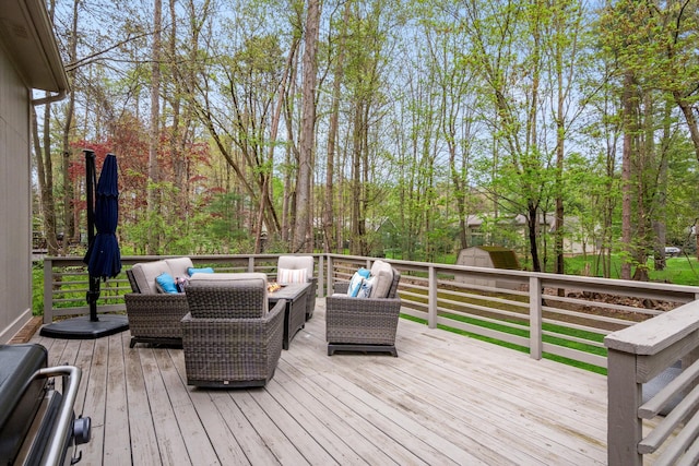 deck featuring a storage unit, an outdoor structure, and outdoor lounge area