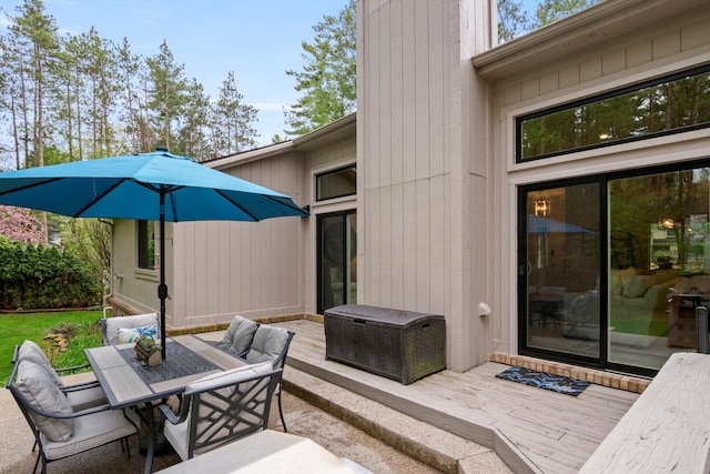 view of patio featuring a deck and outdoor dining space