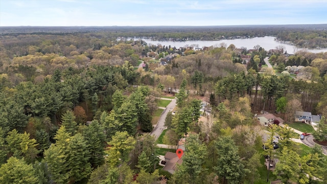 bird's eye view featuring a water view and a wooded view