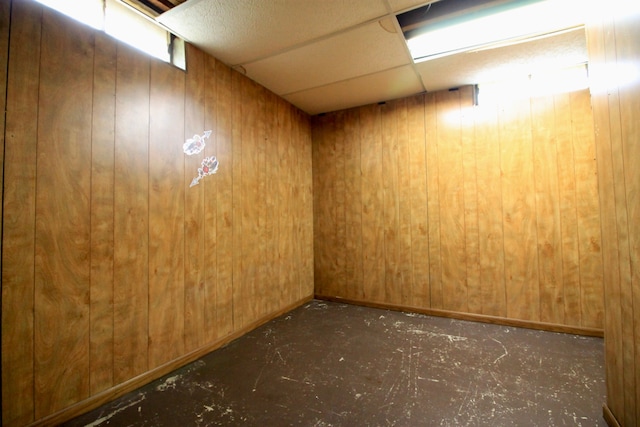 basement with elevator and wood walls