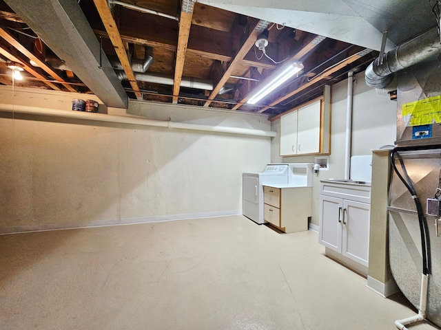 unfinished below grade area featuring washer and dryer