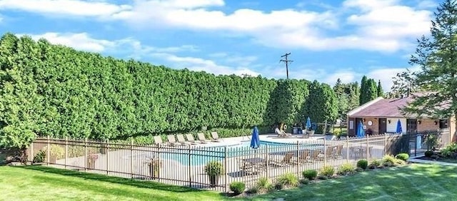 pool with fence and a patio area