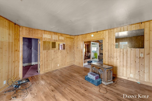 114 E St, Coopersville, MI 49404 - empty room with baseboards, wood walls, and wood finished floors