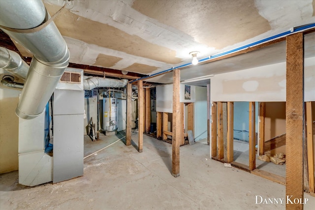114 E St, Coopersville, MI 49404 - unfinished below grade area with heating unit and water heater