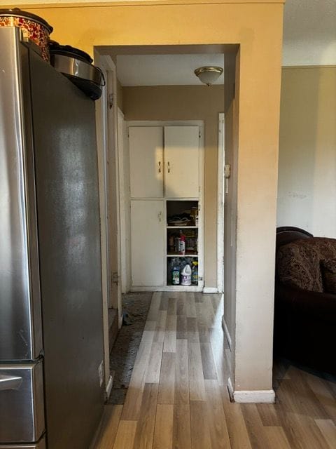 hall featuring wood finished floors